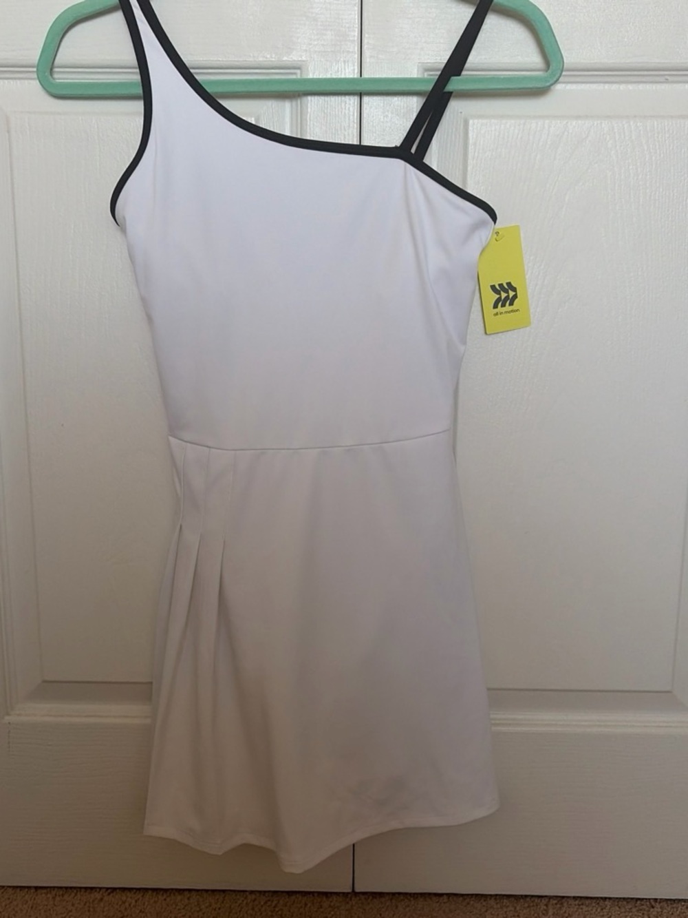 White active dress. All In Motion. Size XS. Built in shorts with pockets. NWT.